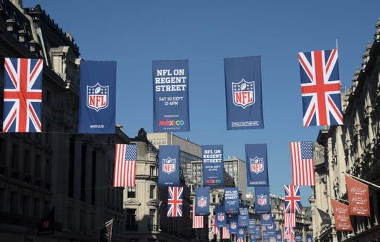 General overall view of British and United States flags and NFL shield logo banners on Regent Street. [Kirby Lee/USA TODAY Sports]