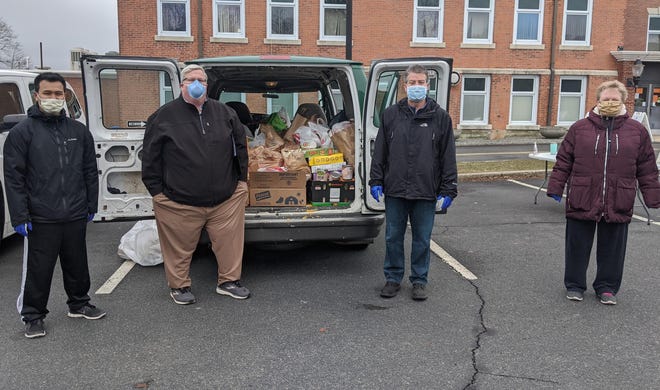 As the coronavirus pandemic continues, demand for food from area pantries the economic fallout has increased. Food drives, like the one for the Friendly Food Pantry in Randolph (above), have helped communities. [Courtesy photo]