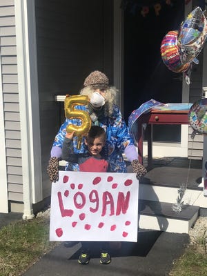 Logan Gajewski of Millbury, who turned 5 April 28, 2020, with his Nana, Joan Boisvert, who dressed up for the special occasion. [Submitted Photo]