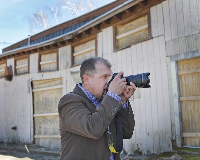David Whitemyer of Rockland with his first photo book, "Abandoned Massachusetts," that explores shuttered and abandoned buildings.

[Patriot Ledger Staff Photo/Greg Derr]