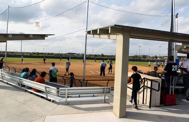 People gathered at the Adult Recreation Complex during its grand opening in March, shortly before outdoor facilities were closed due to the coronavirus pandemic. Some outdoor facilities, including softball fields, reopened on Monday with groups limited to four people. [PHOTO BY ARIANA GARCIA]