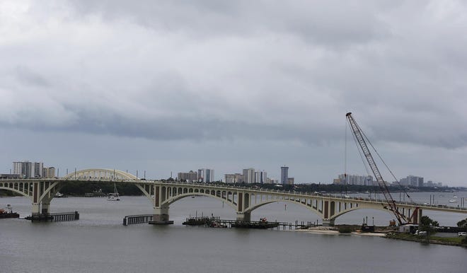 Daytona Beach’s Orange Avenue bridge was originally set to open more than a year ago. The latest projection is it could be open May 19, and totally completed around July 18. [News-Journal/Nigel Cook]