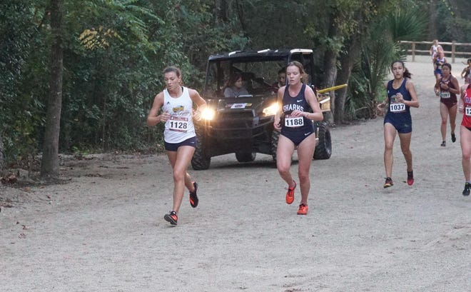 Former Effingham County High School standout Catherine Hall, in white, posted her best collegiate time with a 20:28.1 in the 5-kilometer Florida State University Invitational on Oct. 11, 2019. [COURTESY GEORGIA SOUTHWESTERN]