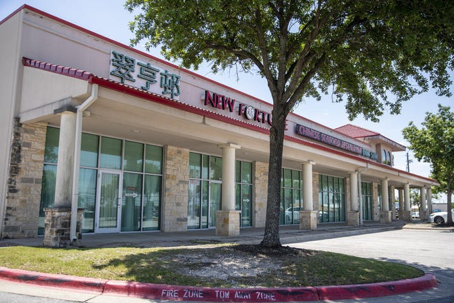 A parking lot at Chinatown Center on North Lamar Boulevard sits mostly empty Wednesday. As many Asian American businesses across the city weigh reopening, the Greater Austin Asian Chamber of Commerce is planning a webinar Tuesday for business owners who might be concerned about potentially becoming targets of misdirected anger over the coronavirus pandemic. [RICARDO B. BRAZZIELL/AMERICAN-STATESMAN]