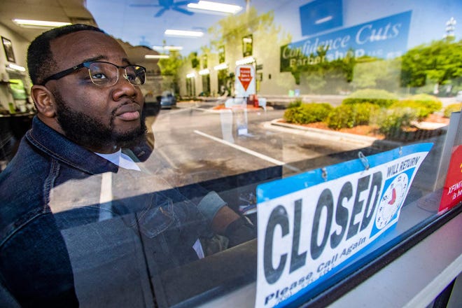 Sherman Williams, owner of Confidence Cuts in Tallahassee, will be able to reopen barbershop. [Alicia Devine/Tallahassee Democrat]