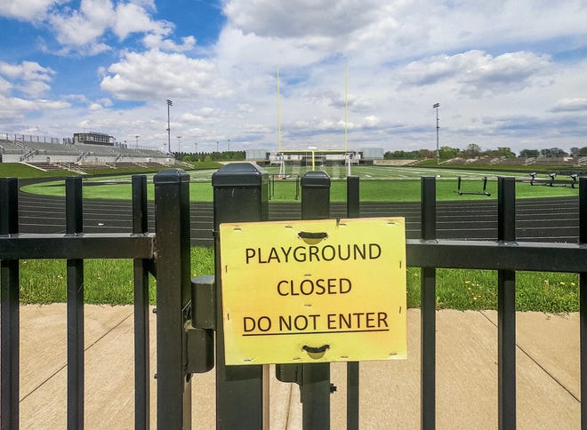 The entrance to Galesburg High School's C.C. Van Dyke Field is locked and marked with a closed sign. [JAY REDFERN/THE REGISTER-MAIL]