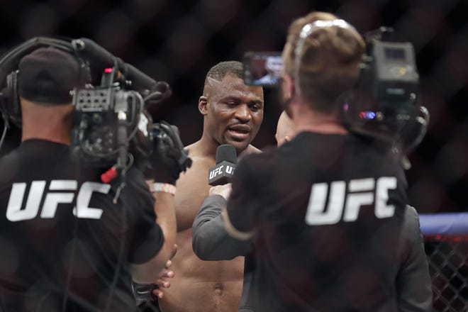 Francis Ngannou is interviewed after winning a UFC 249 mixed martial arts bout against Jairzinho Rozenstruik on May 9, 2020, in Jacksonville, Fla. [AP File Photo/John Raoux]