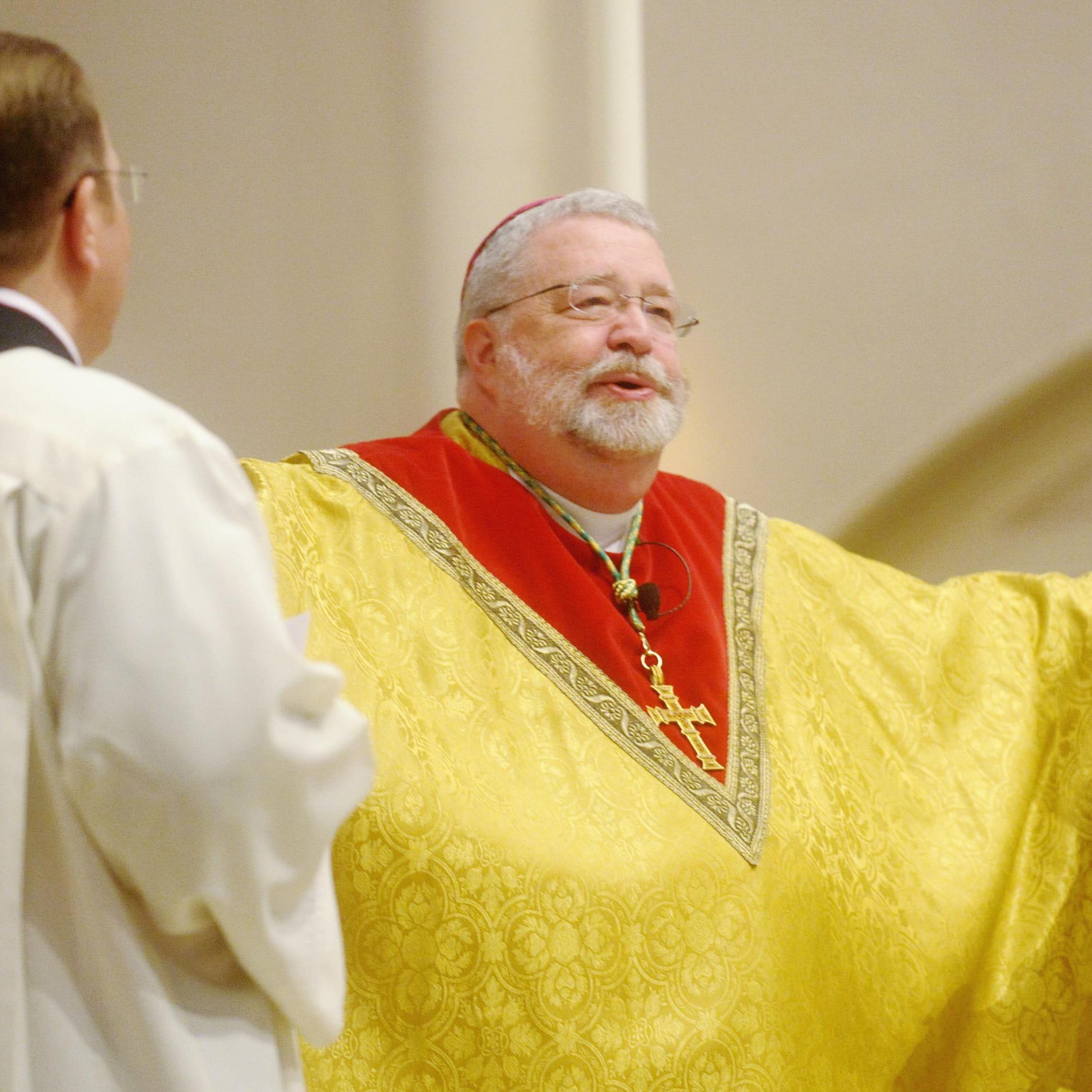 Bishop Daniel Jenky leads services on Easter Sunday in 2013 at St. Mary's Cathedral. [NICK SCHNELLE/JOURNAL STAR FILE PHOTO]