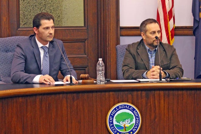Hillsdale Mayor Adam Stockford and city Manager David Mackie listen to a presentation during a previous council meeting. [File Photo]