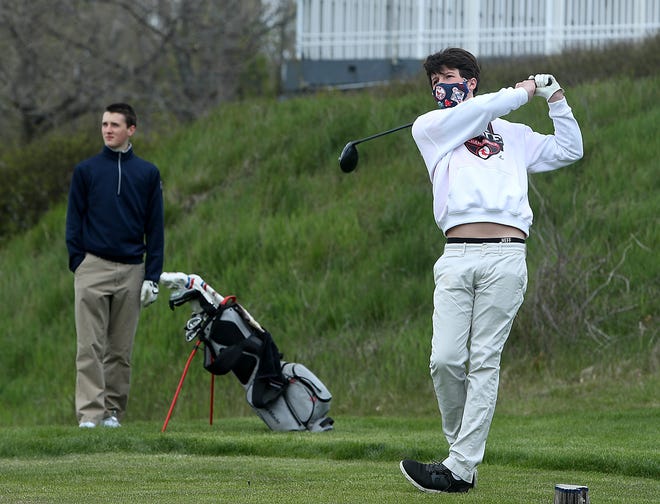 John-Henry Sherwood, 16, of Hingham watches his opening drive while golfing with friends at the South Shore Country Club on Saturday. [Wicked Local Staff Photo/ Robin Chan]