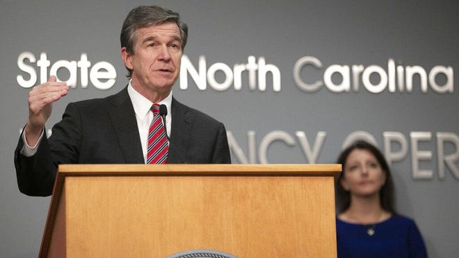 Governor Roy Cooper gives an update on the COVID-19 virus and phase one of re-opening the state's economy during a press briefing on Tuesday, May 12, 2020 at the Emergency Operations Center in Raleigh, N.C.