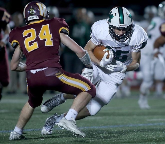Marshfield's Cade Chabra gets some extra yards after making a catch against Weymouth. The senior played both football and lacrosse for the Rams. [Wicked Local Staff Photo/ Robin Chan]