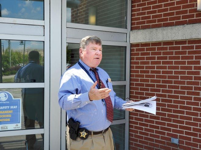 Onslow County Sheriff Hans Miller explaining to the media the departments stance for not interfering with churches who wish to all services inside Thursday afternoon. [Trevor Dunnell / The Daily News]