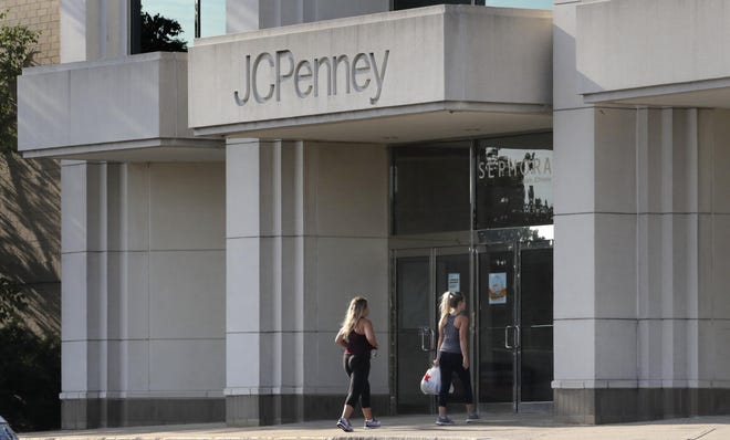 In this Wednesday, Aug. 14, 2019, photo two women walk into the JCPenney store in Peabody, Mass. (AP Photo/Charles Krupa)