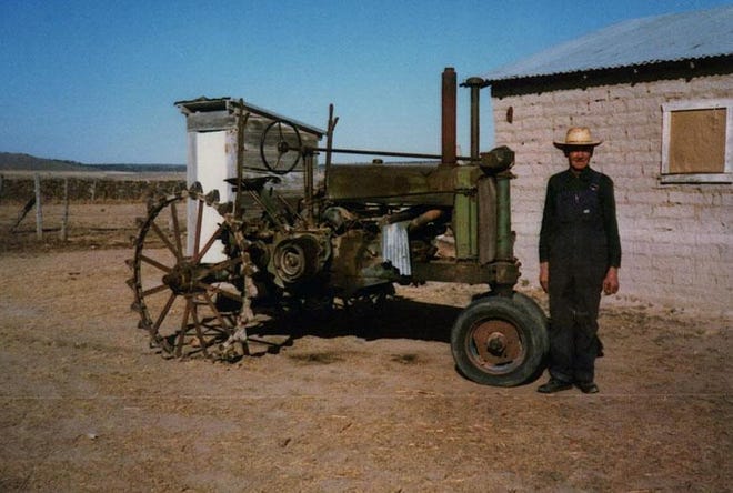 Pictured is a typical Mennonite tractor with rubber tires removed and spokes welded on. [Provided by author]