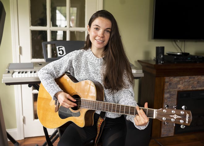 Ciara Cargiulo, a freshman at Worcester State University, is pictured inside her at-home recording studio in Paxton. [T&G Staff/Ashley Green]