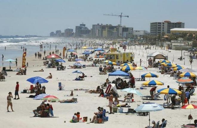Beachgoers take advantage of the beach re-opening in Daytona Beach on Saturday, May 2, 2020. [News-Journal/Nigel Cook]