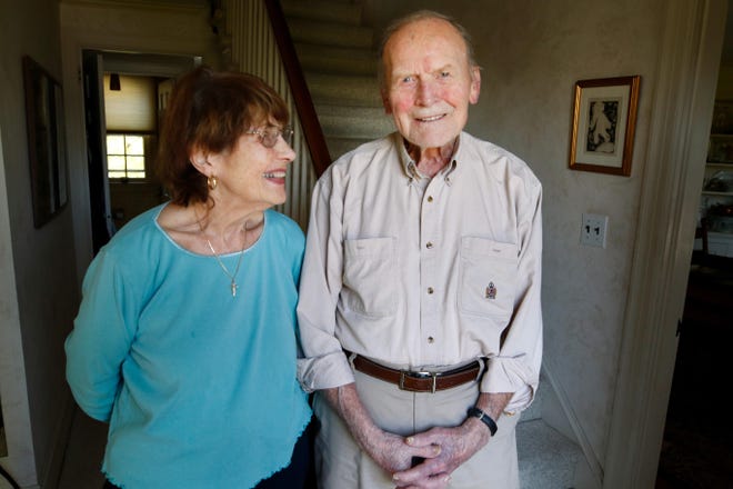 World War II veteran Gene Perry, with wife Elaine in their Pawtuxet home, comes from a seafaring family, served in the Navy, and went on to row and coach crew. [The Providence Journal / Kris Craig]