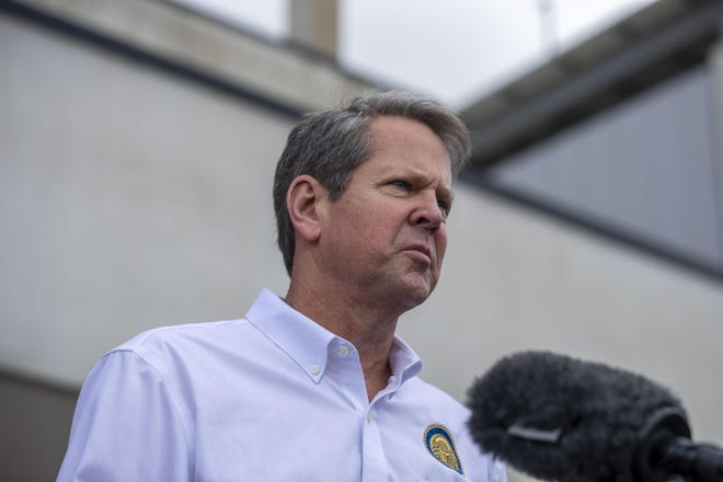 Governor Brian Kemp makes a statement and answers questions from the media following a tour of Fieldale Farms while visiting Gainesville, Friday, May 15, 2020. (Alyssa Pointer/Atlanta Journal-Constitution via AP)
