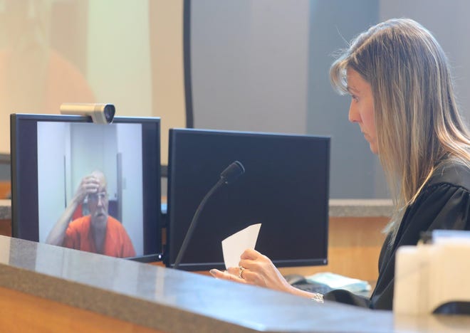 Stow Municipal Court Judge Lisa Coates talks with James Zastawnik during a video arraignment earlier this month. Zastawnik is charged with the 1987 rape and slaying of teenager Barbara Blatnik. [Phil Masturzo/Akron Beacon Journal]