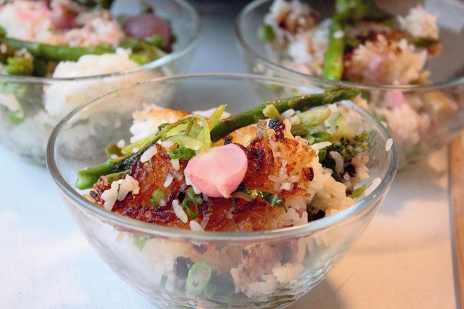 Crispy fried rice is made with leftover rice, frozen peas and window sill scallions, plus fresh spring asparagus and radishes. (Louisa Chu/Chicago Tribune/TNS)