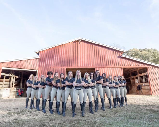 University of Alabama equestrian team captain Lauren Woods of Portsmouth stands in front of her teammates. [CONTRIBUTED PHOTO]