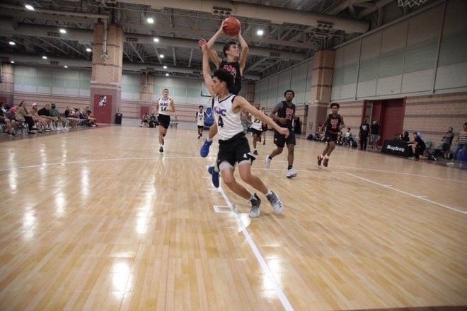 Anton Ciccarelli, a Natick High junior, pictured playing non-school basketball. Representing Natick and playing as the Philadelphia 76ers, Ciccarelli defeated AMSA's Soham Santikary, who was playing as the Los Angeles Lakers in the Daily News "March Madness in May" NBA 2K video game tournament. [Courtesy Photo]