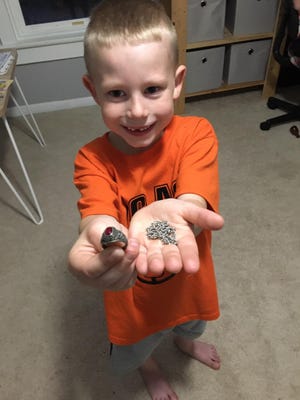 Jase Sauder, 6, of Lucas, found a 1983 class ring belonging to Yvonne Pollard, who now lives in Florida. His dad is sending the ring back to its grateful owner. [Andrew Sauder]