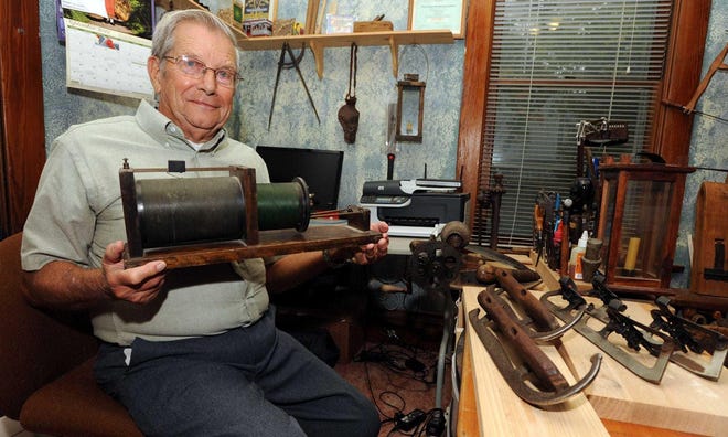 Long-time Marion radio personality Charlie Evers was also a history buff. He is shown here with a 1916 receiving transformer, one of the earliest forms of radio. [Bill Sinden/The Marion Star]