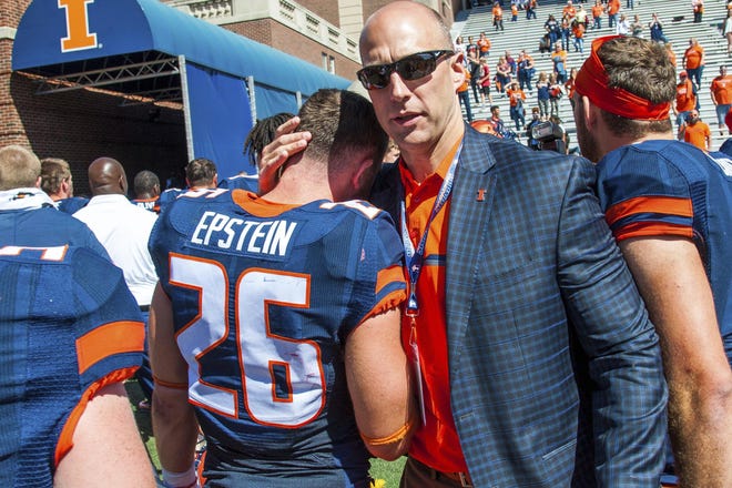 Illinois athletic director Josh Whitman, left, hugs Illinois running back Mike Epstein after a game in 2017. [BRADLEY LEEB/The Associated Press]