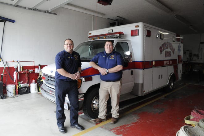 Byesville Volunteer Fire Department Chief, Tim Haren and EMS squad leader, Jeremy Rice stand in front of the ambulance put into service on April 27, allowing the department to provide emergency medical services and patient transport.