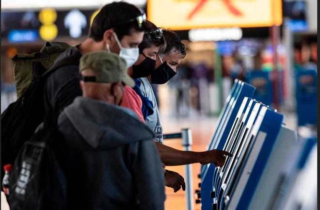 Safety measures now in place involving face coverings and social distancing could become permanant parts of flying.

[Photo/USA TODAY]