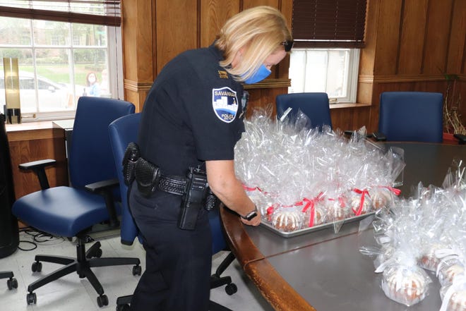 Savannah police accept a donation of 300 cakes on Wednesday, May 28. [Photo courtesy of the Savannah Police Department]