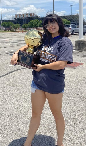 Hutto senior defender Gabrielle Segura holds the Hippos’ district championship trophy from this year. The team finished 14-3 on the season, 10-1 in District 18-5A, sharing the title with Georgetown. [Contributed by the Segura family]