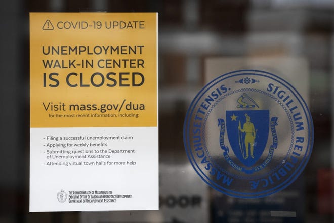 A sign announces the closure of an unemployment office earlier this month in Boston.  [AP Photo]