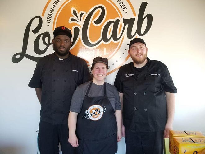 Laurie Penninga, owner of Low Carb Grill, poses for a photo with her pastry chef (left) and head chef (right). [Contributed]