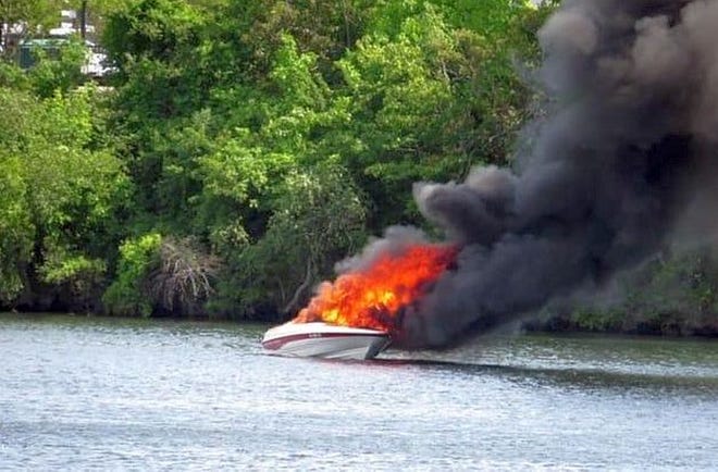 A powerboat is engulfed in flames on Lake Quinsigamond on Saturday. [Photo/Shrewsbury Fire Dept. via Facebook]