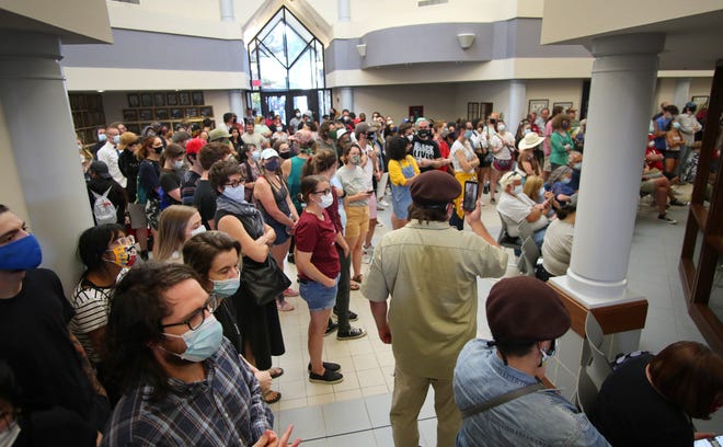 Protesters at a June 9 city council meeting in Norman call for defunding the police. A judge has ruled the Norman City Council improperly cut funding to the police department. [Doug Hoke/The Oklahoman]