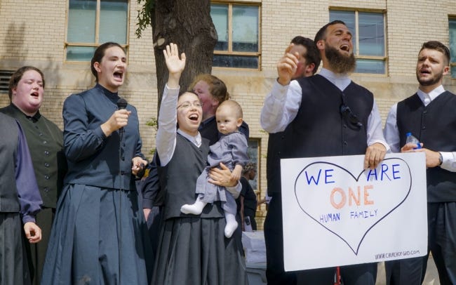 Church of God members Hannah Bontrager, left, Elizabeth Tovstigah, center, and Markus Tovstigah sing Friday afternoon at a protest in front of the Oklahoma City Police Department. [Jordan Green/The Oklahoman]