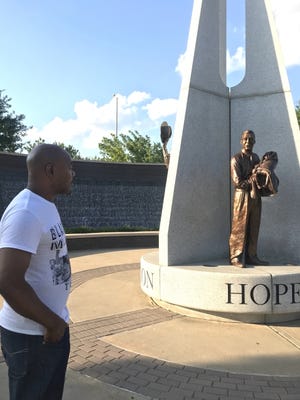 The Rev. Mareo Johnson, a leader of Black Lives Matter-Tulsa, visits the John Hope Franklin Reconciliation Park in Tulsa's Greenwood District. [Carla Hinton/The Oklahoman]