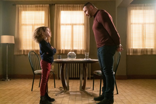 Sophie (Chloe Coleman) demands a spying lesson from JJ (Dave Bautista). [STX]