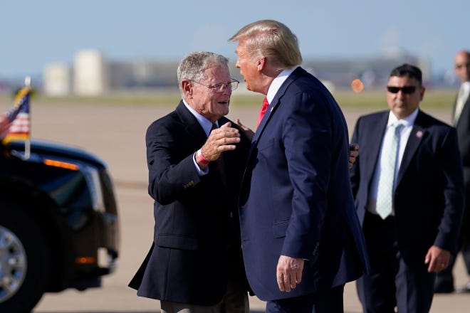 In this June 20, 2020 file photo, Sen. Jim Inhofe, R-Okla., hugs President Donald Trump as he arrives at Tulsa International Airport in Tulsa. [AP Photo/Evan Vucci]