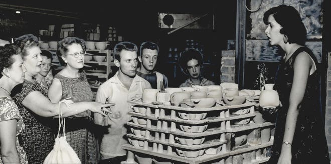 Joniece Frank explains the process of creating Frankoma Pottery in her parents’ factory in August 1956. This photo was published with a story about the Sapulpa pottery plant in The Daily Oklahoman Magazine. The headline read, “They Found Pay Dirt in Clay.” John and Grace Lee Frank initially founded the business in 1933 in Norman as Frank Potteries and then moved it to Sapulpa in 1938. The business, which changed its name to Frankoma Potteries, incorporating Oklahoma into the new name, produced handcrafted dinnerware, artware, jewelry and more. The sturdy, artistic pieces with a Southwest flair became a mainstay in many homes in Oklahoma and across the United States. Throughout its history, the business endured fires, financial problems and multiple sales. Frankoma products were created with Oklahoma clay and are collector’s items. [JOHN GUMM/THE OKLAHOMAN ARCHIVES]