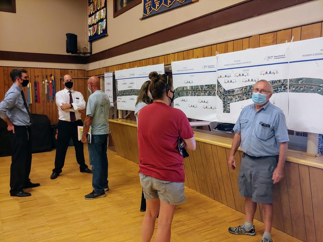 Canisteo residents talk with project staff from the state Department of Transportation Tuesday at Somers Hall. Paving and pedestrian enhancements are planned for 2022-2023. [Chris Potter/The Spectator photos]