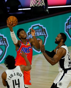 Aug 14, 2020; Lake Buena Vista, Florida, USA; Hamidou Diallo #6 of the Oklahoma City Thunder goes up for a basket as Terance Mann #14 of the LA Clippers looks on during the fourth quarter at The Field House at ESPN Wide World of Sports Complex. Mandatory Credit: Mike Ehrmann/Pool Photo-USA TODAY Sports