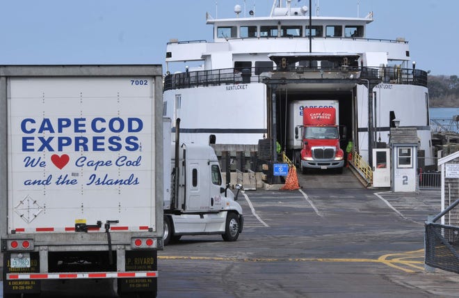 Freight trucks load onto a Steamship Authority ferry from Woods Hole to Martha’s Vineyard. The ferry line’s board voted recently to keep its 5:30 a.m. run to the island despite concerns voiced by some Woods Hole residents. [Steve Heaslip/Cape Cod Times file]
