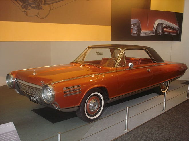Introduced in 1963, the Chrysler Turbine Car with its jet-like gas turbine engine arrived for a unique test drive evaluation. The rear featured the novel backup light “afterburners.” [Chrysler Corporation/Fiat Chrysler]