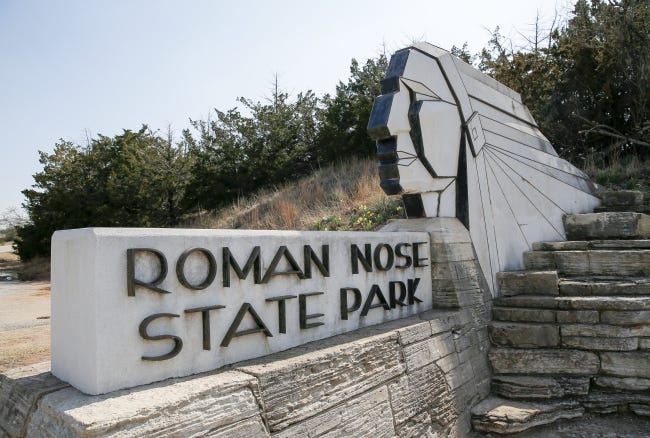 A sign at an entrance to Roman Nose State Park, north of Watonga, Okla., Monday, March 25, 2019. Photo by Nate Billings, The Oklahoman