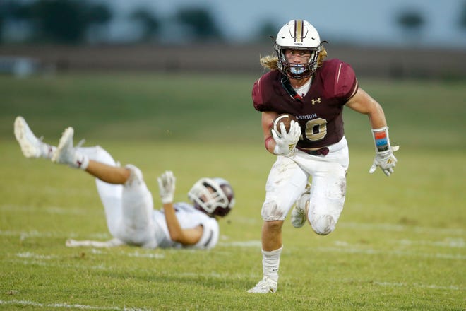 Cashion's Brexten Green carries the ball during a high school football game between Cashion and Perry in Cashion, Okla., Friday, Sept. 4, 2020. [Bryan Terry/The Oklahoman]