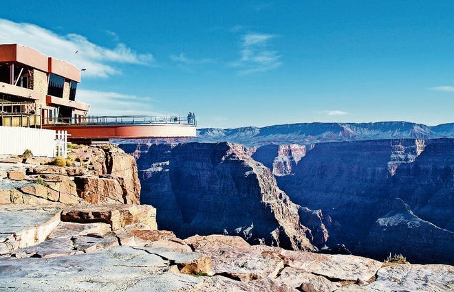 The Skywalk allows guests to traverse 70 feet out over the Grand Canyon’s rim and peer through its glass walkway at the canyon floor 4,000 feet below. [CR RAE]